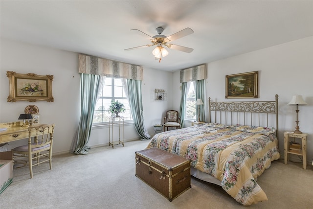 bedroom with ceiling fan and light colored carpet