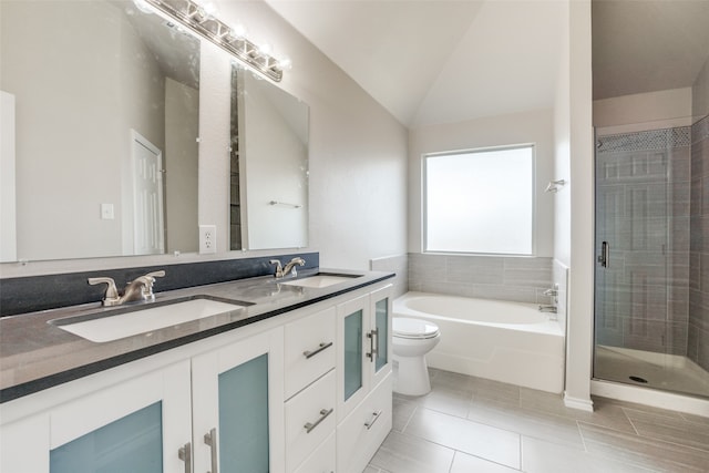 full bathroom with lofted ceiling, tile patterned flooring, dual vanity, and plus walk in shower