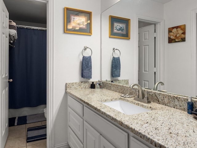 full bath with tile patterned flooring, curtained shower, vanity, and toilet