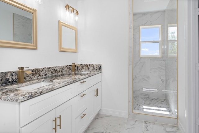 bathroom with double sink vanity, tile patterned floors, and a tile shower