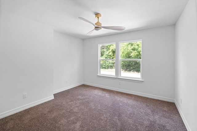 empty room featuring ceiling fan and carpet floors