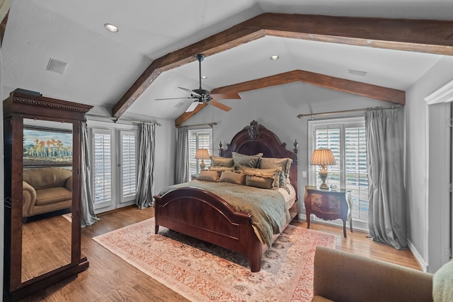 bedroom with ceiling fan, light hardwood / wood-style flooring, and vaulted ceiling with beams