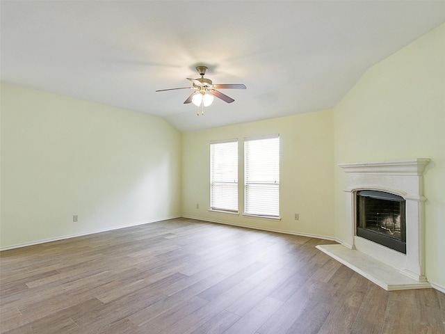 unfurnished living room with ceiling fan, light hardwood / wood-style flooring, and vaulted ceiling