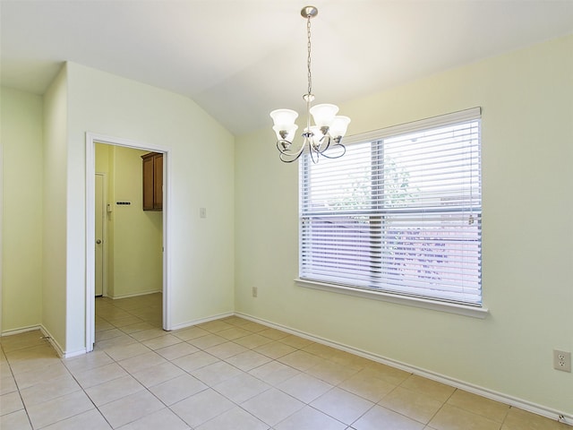 interior space with a notable chandelier, light tile patterned floors, and lofted ceiling