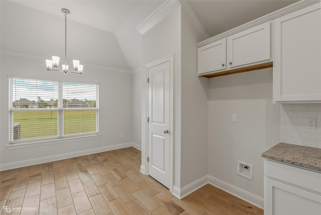 interior space with crown molding, light hardwood / wood-style flooring, and a chandelier