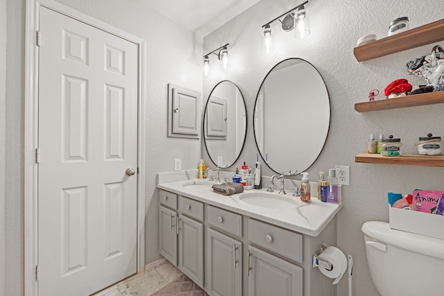 bathroom with vanity and toilet