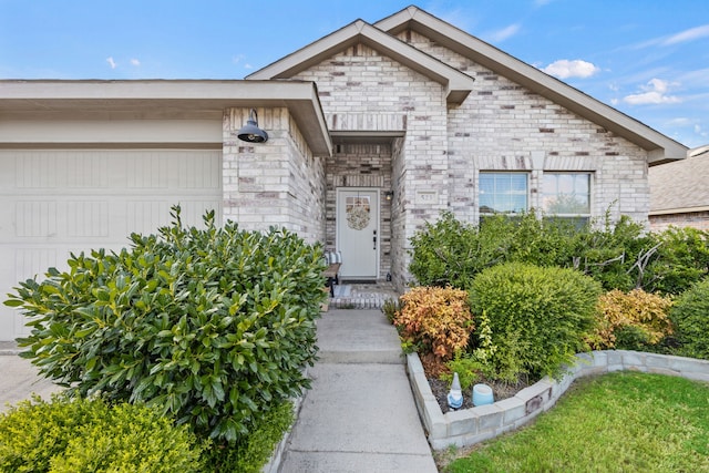 doorway to property featuring a garage