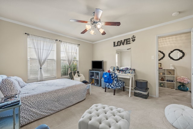 carpeted bedroom featuring ornamental molding and ceiling fan