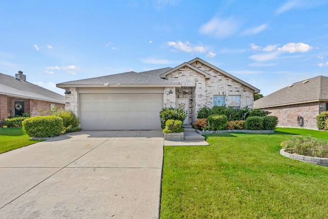 view of front of home with a garage and a front lawn