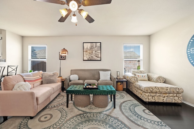 living room with hardwood / wood-style floors and ceiling fan