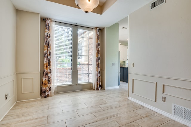 spare room with plenty of natural light