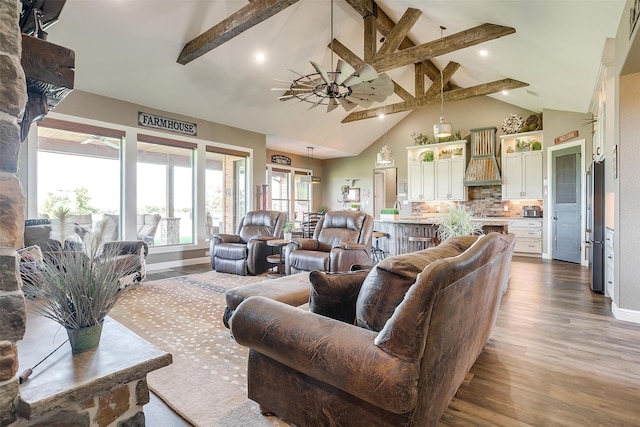 living room with ceiling fan, beamed ceiling, sink, high vaulted ceiling, and hardwood / wood-style flooring