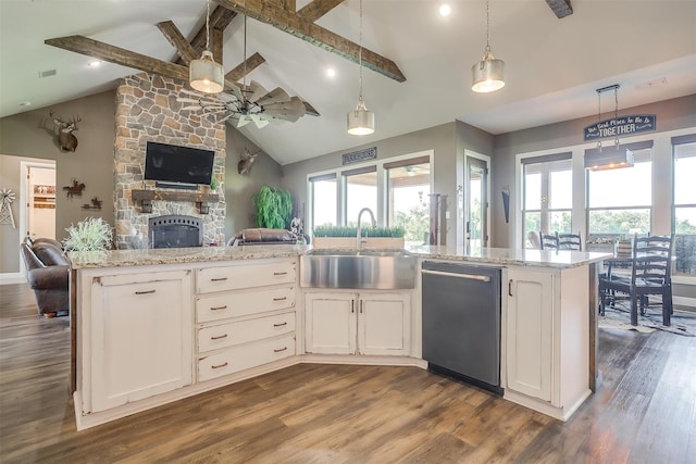 kitchen featuring pendant lighting, sink, white cabinetry, dishwasher, and dark hardwood / wood-style flooring