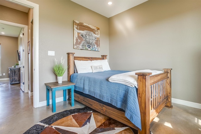 bedroom featuring concrete floors