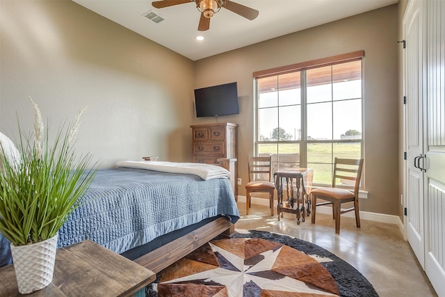 bedroom with multiple windows and ceiling fan