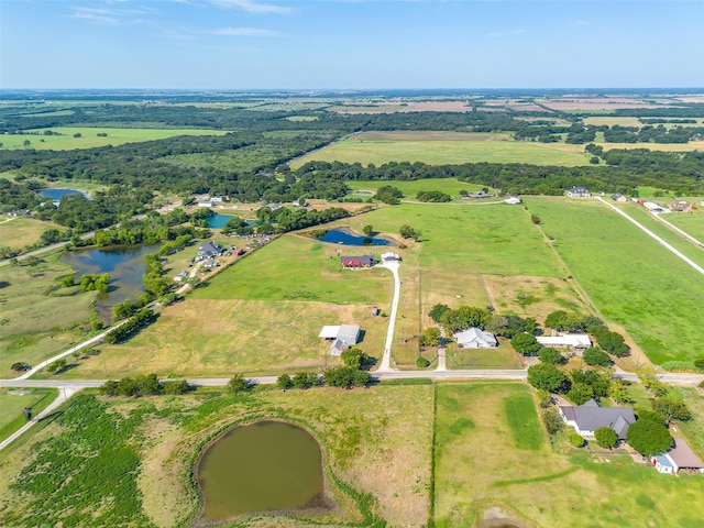 bird's eye view with a rural view and a water view