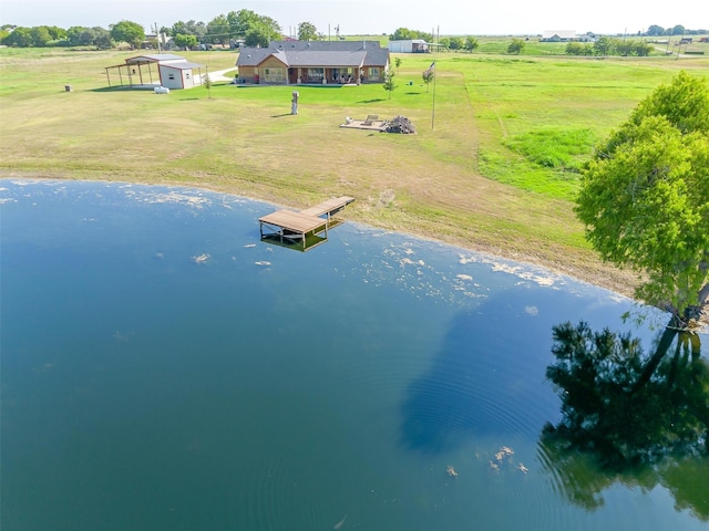 bird's eye view with a water view and a rural view