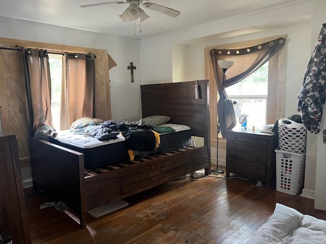 bedroom with ceiling fan and dark wood-type flooring