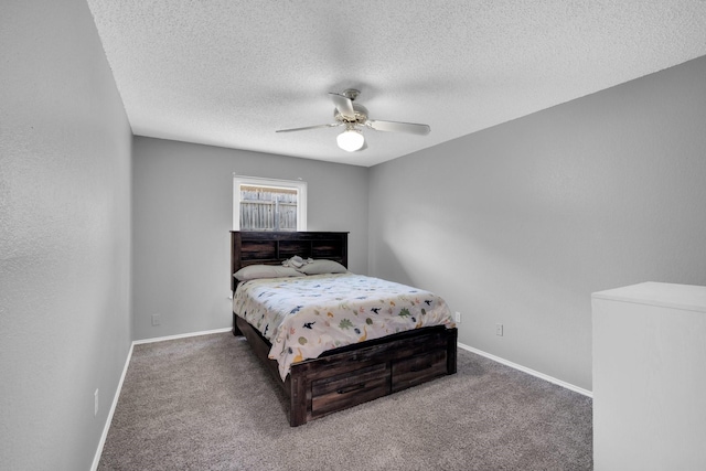 carpeted bedroom with a textured ceiling, baseboards, and a ceiling fan