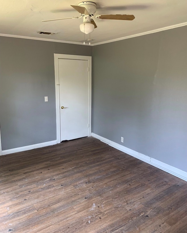 empty room with ceiling fan, crown molding, and wood-type flooring