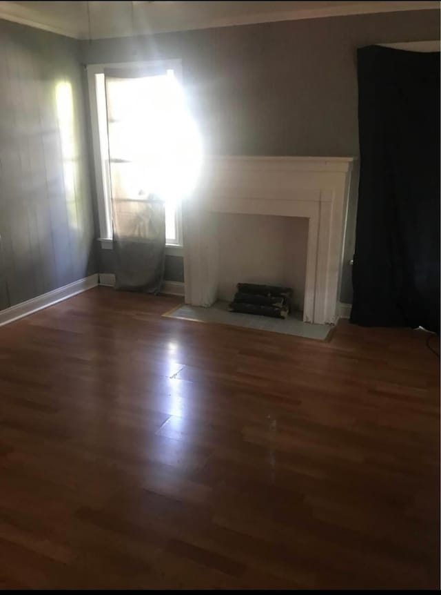 unfurnished living room featuring hardwood / wood-style flooring