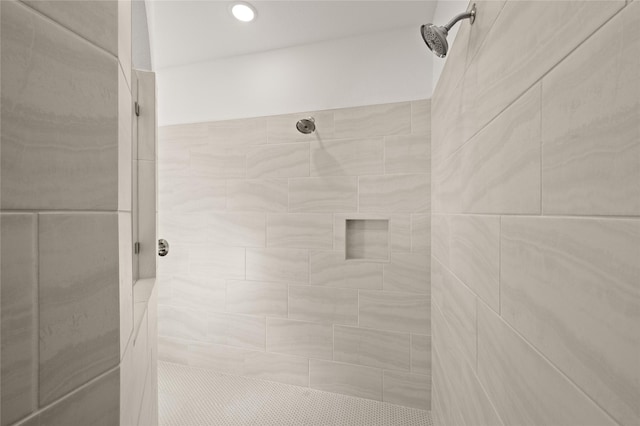 bathroom with tiled shower