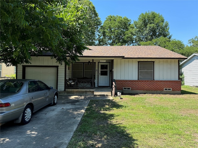 ranch-style house with a front lawn, covered porch, and a garage