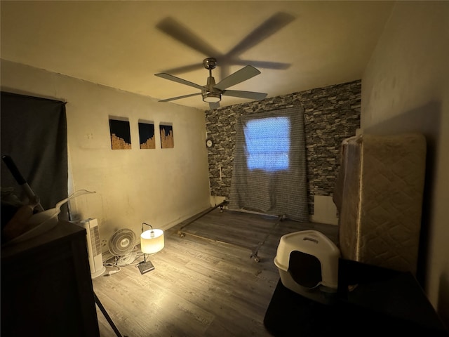 bedroom with ceiling fan and hardwood / wood-style flooring