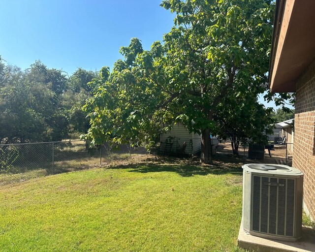 view of yard with central AC