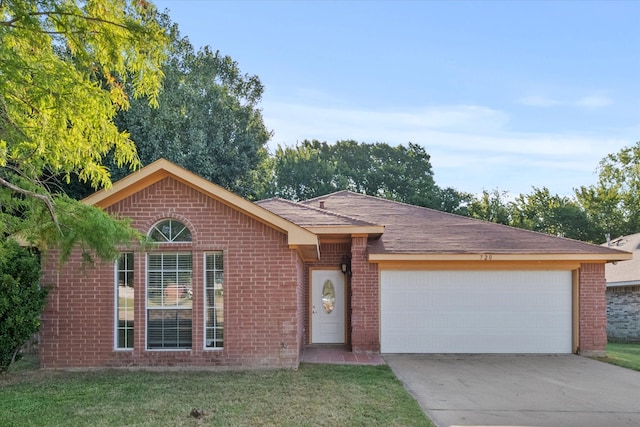 single story home with a garage and a front yard