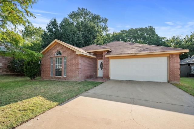 single story home featuring a front lawn and a garage