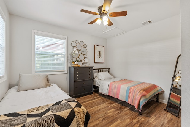 bedroom with ceiling fan and hardwood / wood-style floors