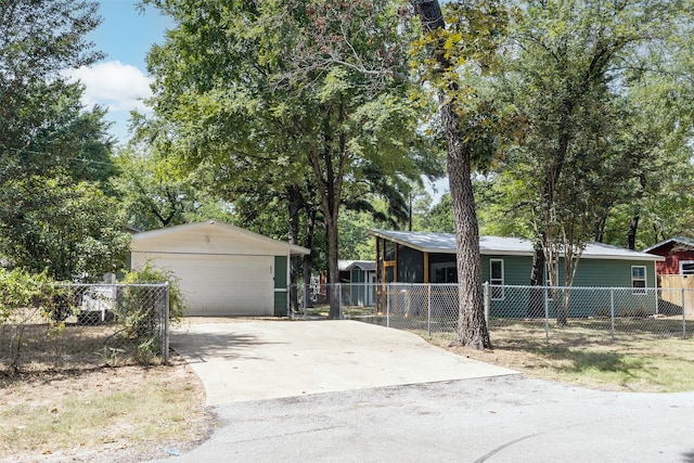 ranch-style house with an outbuilding and a garage