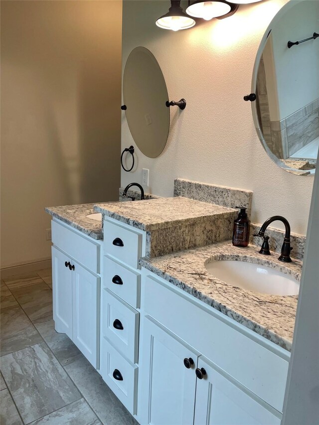 bathroom featuring vanity and tile patterned flooring