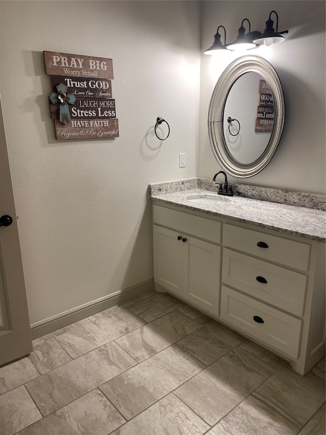 bathroom featuring tile patterned floors and vanity