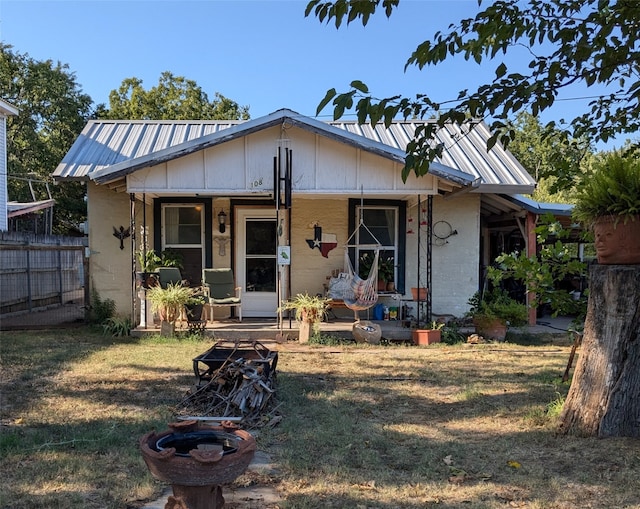 view of front of property with a front yard and a porch