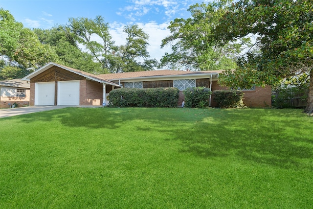 ranch-style home with a front yard and a garage