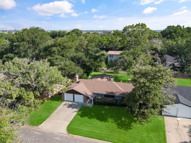 single story home with a garage and a front yard