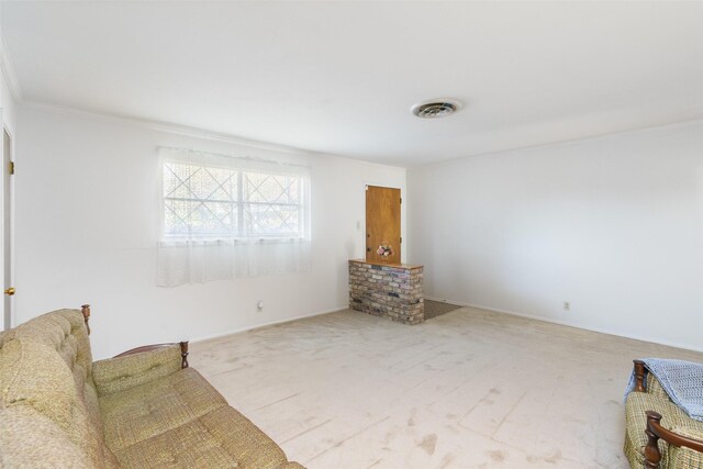 unfurnished room with light colored carpet and ornamental molding