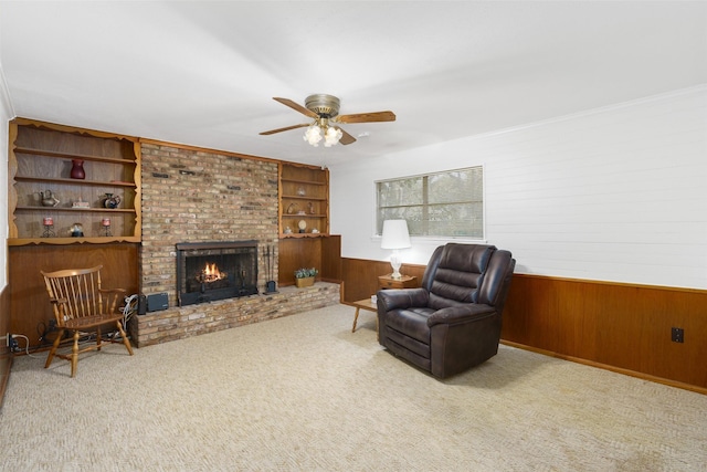 sitting room featuring carpet and crown molding