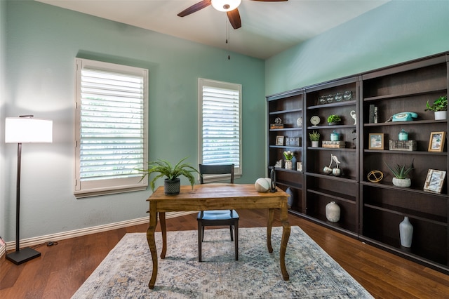 home office with ceiling fan, dark hardwood / wood-style flooring, and a healthy amount of sunlight