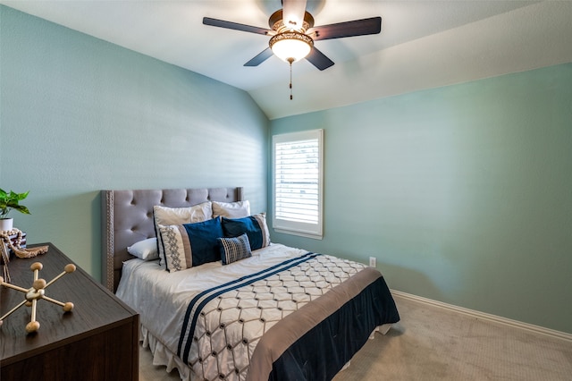 bedroom with ceiling fan, lofted ceiling, and light colored carpet