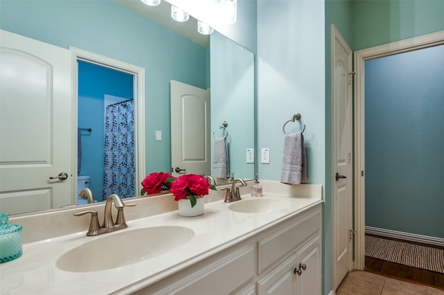 bathroom featuring double vanity and tile patterned floors