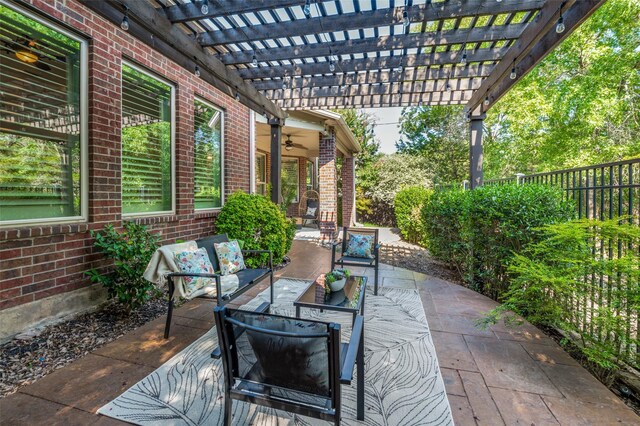 view of patio with ceiling fan, an outdoor hangout area, and a pergola