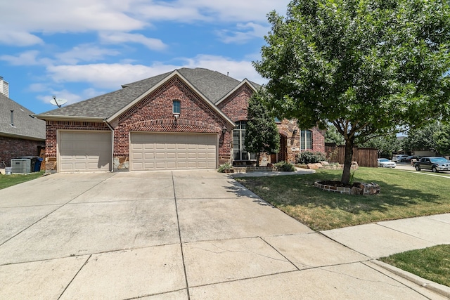 view of front of house with a garage and a front yard