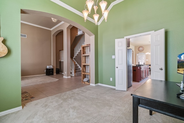 interior space featuring a notable chandelier, tile patterned floors, and crown molding