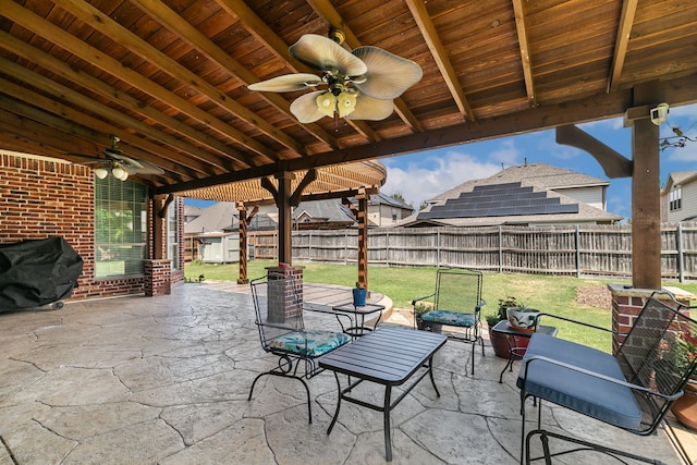 view of patio with ceiling fan and grilling area