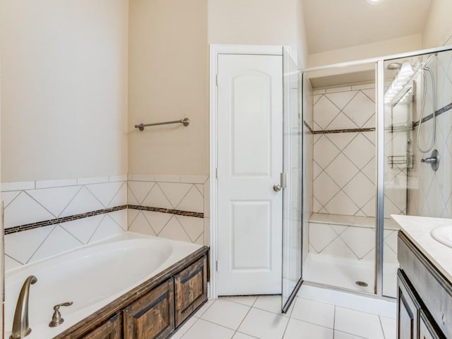 full bathroom with a bath, a shower stall, tile patterned floors, and vanity