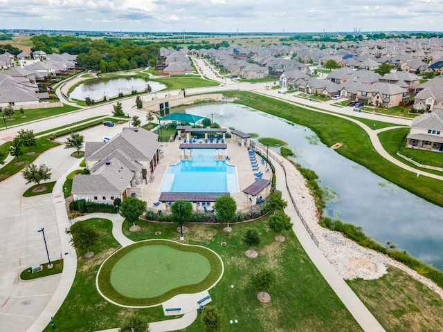 bird's eye view featuring a residential view and a water view