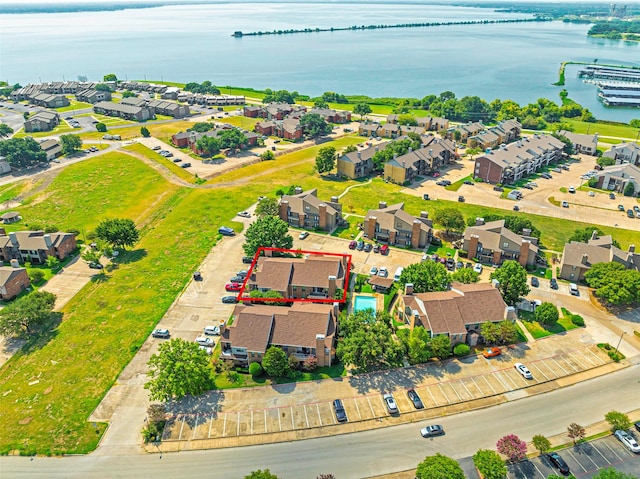 bird's eye view featuring a residential view and a water view